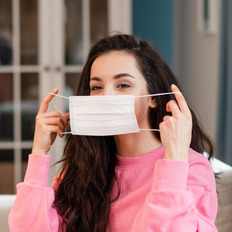 young-blogger-putting-surgical-mask